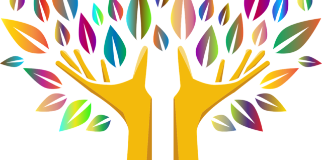 two hands forming a tree with multi-colored leaves